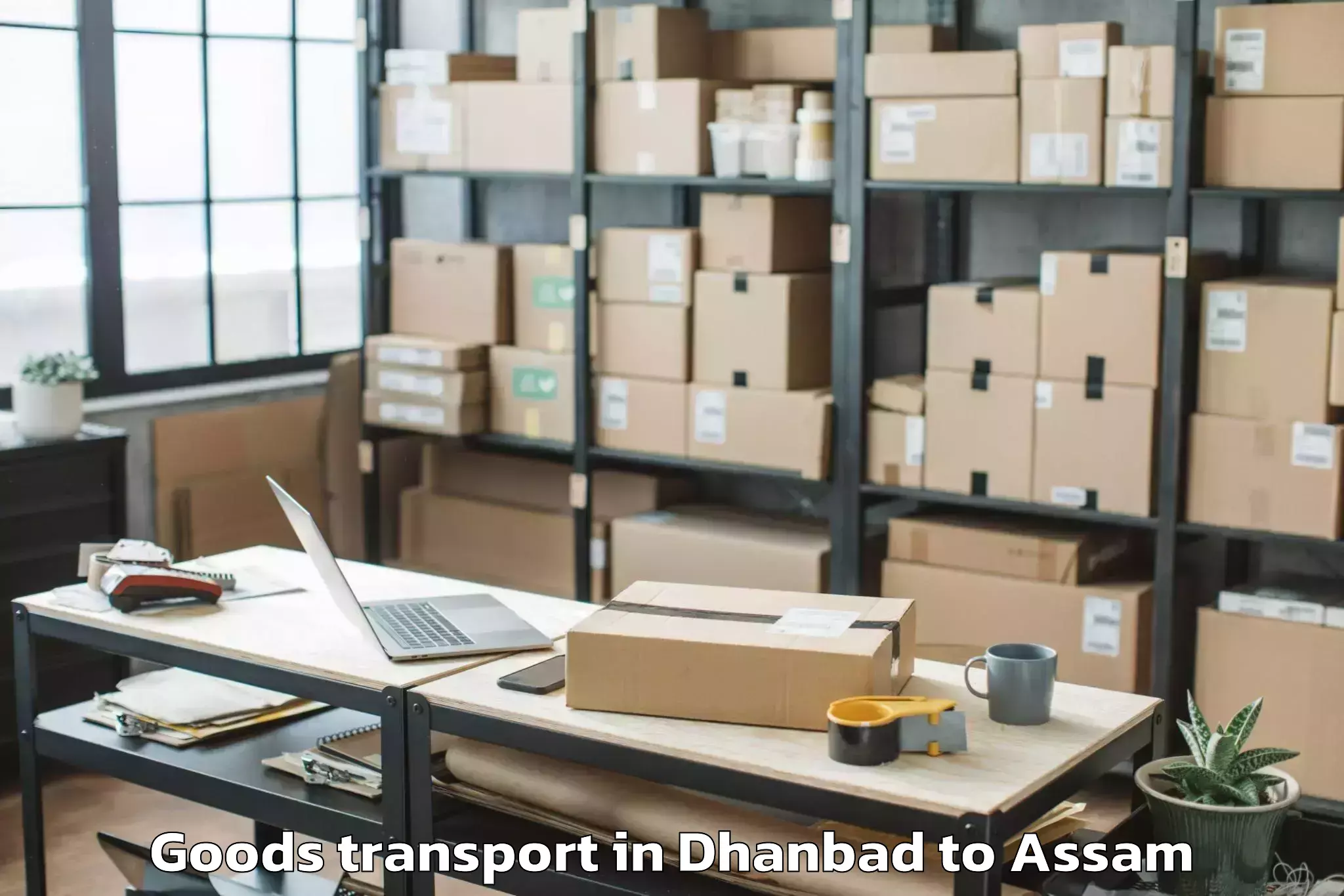 Quality Dhanbad to Pachim Nalbari Goods Transport